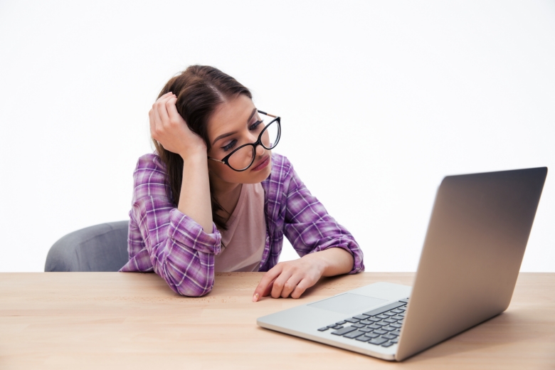 tired-female-student-sitting-with-laptop reduced